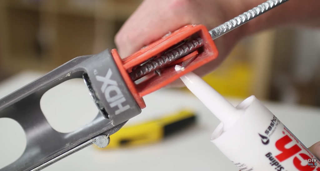 cut caulking tube with spout cutter