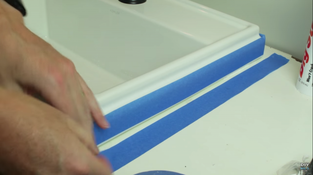 Use painters tape for a perfect edge when caulking